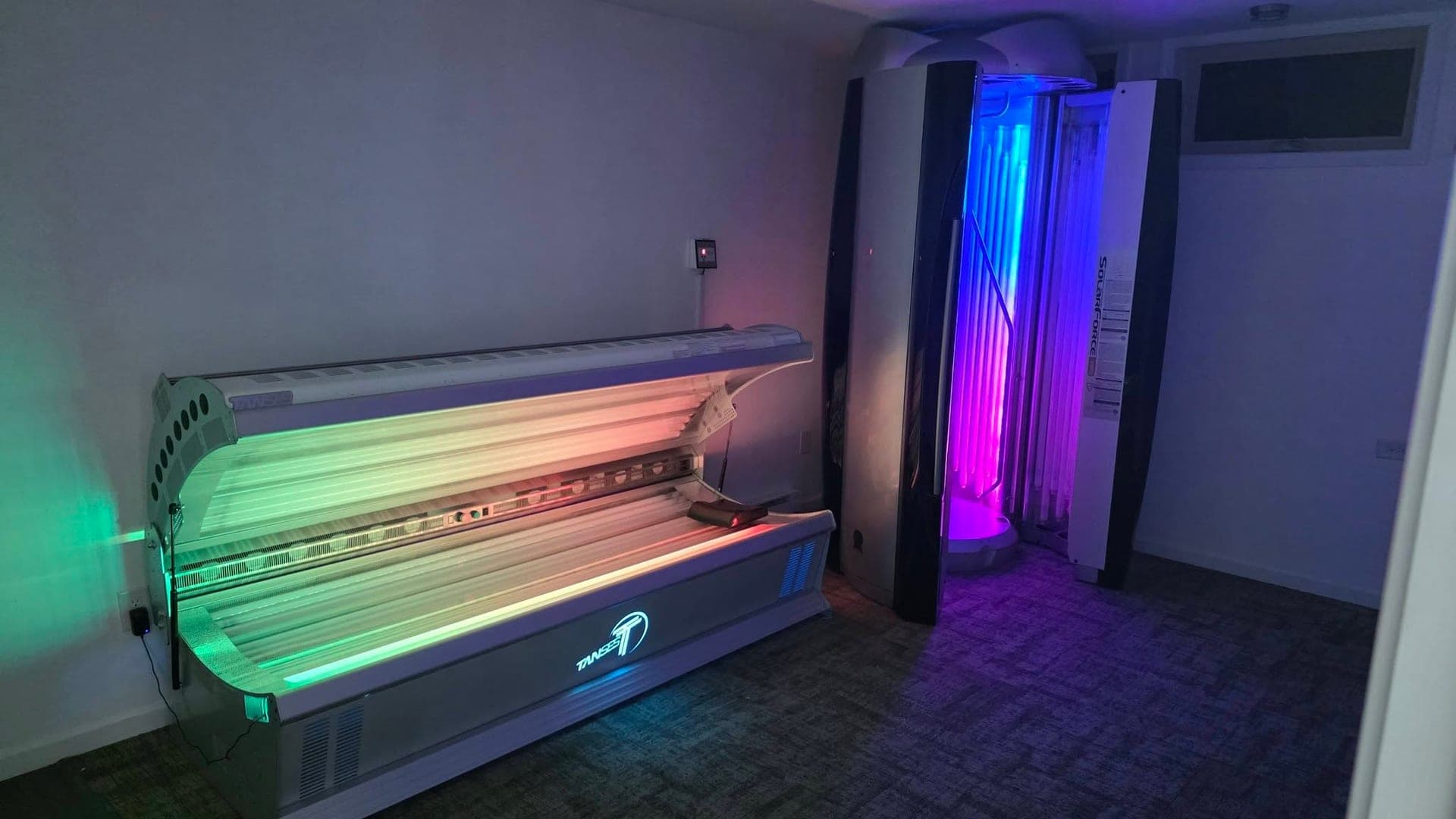 The Level 4 lay-down bed and the Level 5 stand-up booth in the tanning room